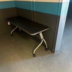 Folding table with wheels