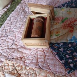 Small wooden box with small perfume bottle