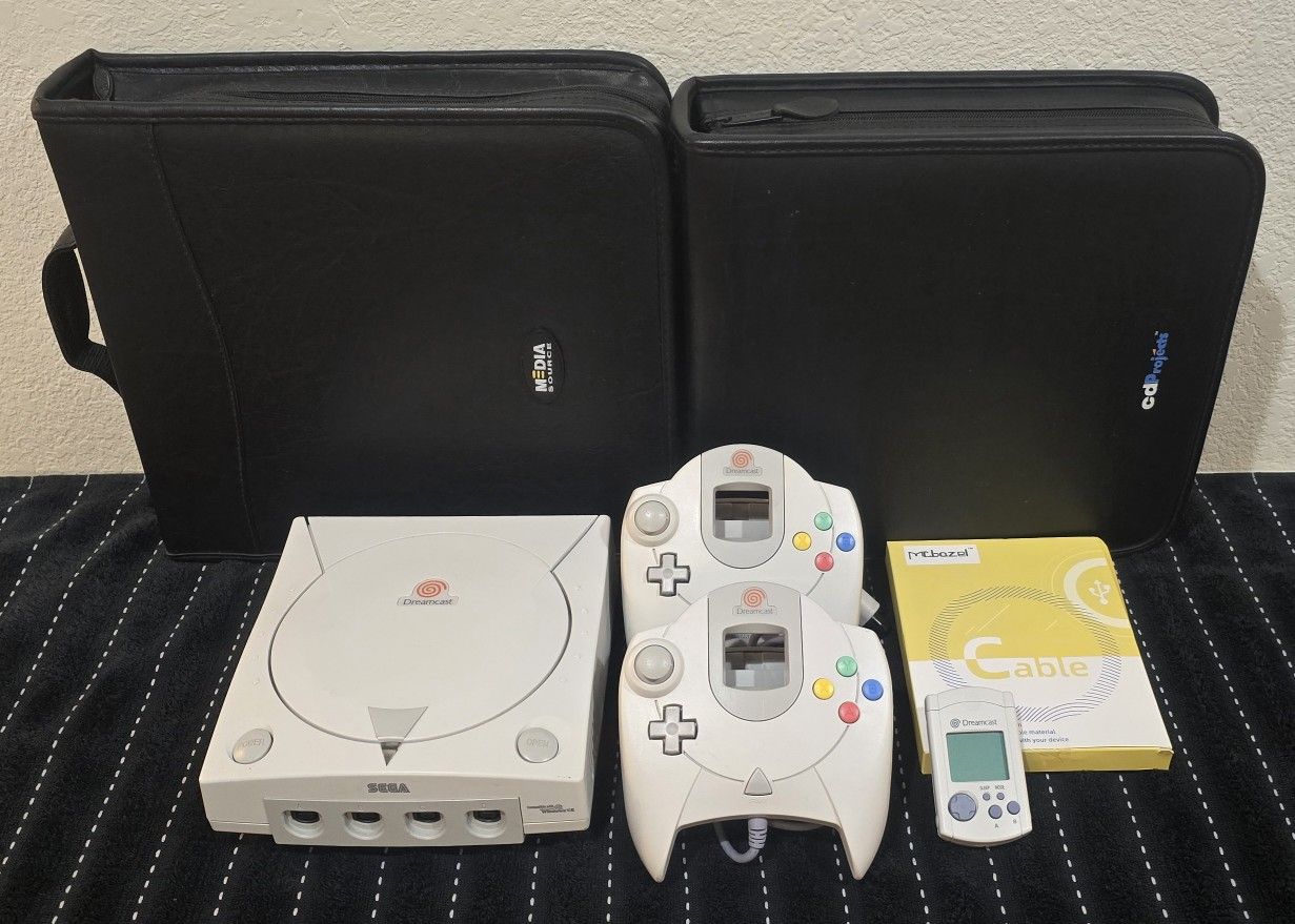 Dreamcast, 2 controllers, 398 games, VMU, s-video cable
