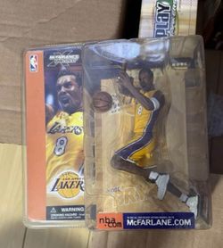 Kobe Bryant figure and championship bubble head dolls