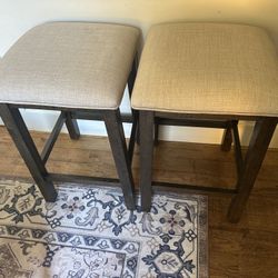 2 Dark Brown Wooden Stools With Beige Cushion 