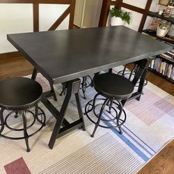 Industrial style table and bar stools
