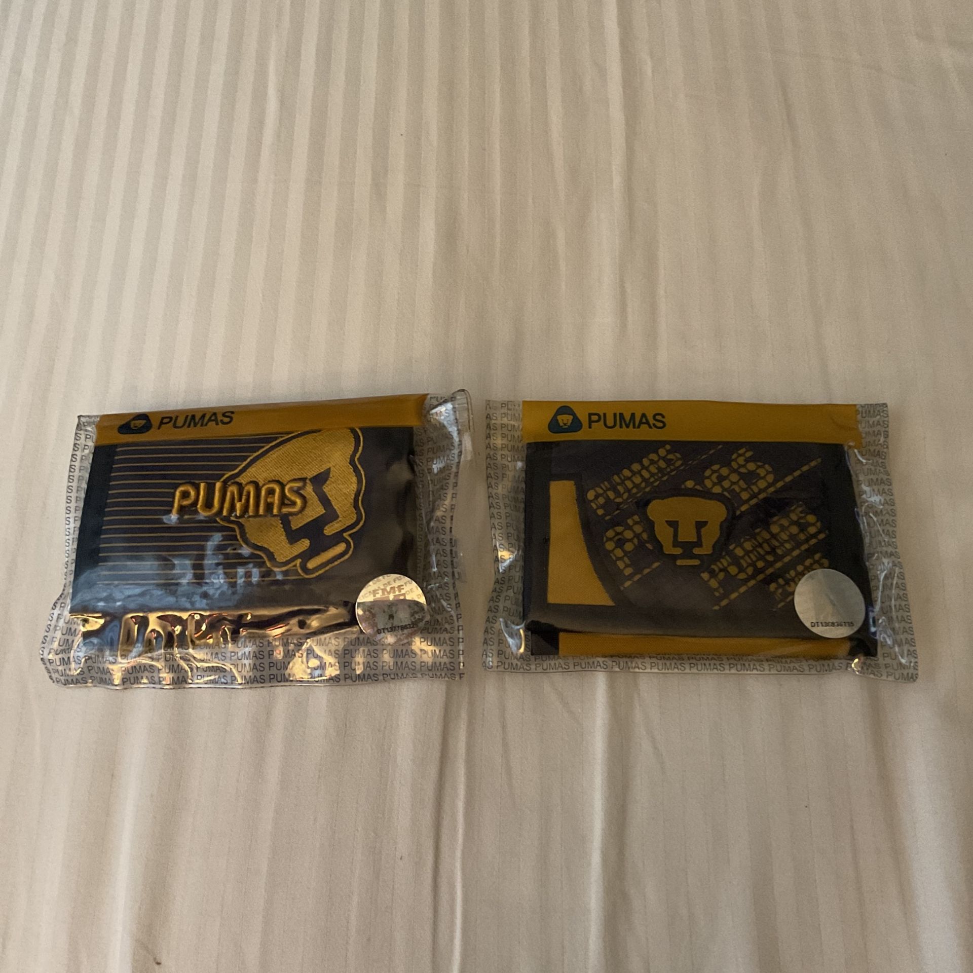 PUMAS WALLETS 12.99. EACH