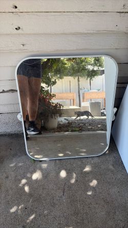 white tilting mirror bathroom