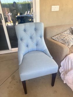 Blue tufted chair