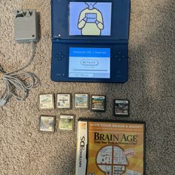 Nintendo DSi XL + 8 Games (hablo Espanol)