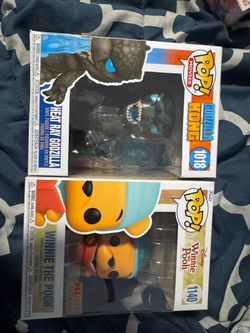 Funko pops Godzilla and Winnie the Pooh
