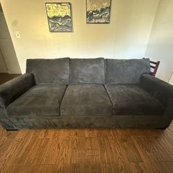 Dark gray sofa couch