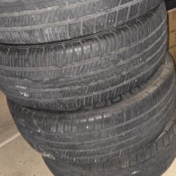 4 slightly used tires with rims
