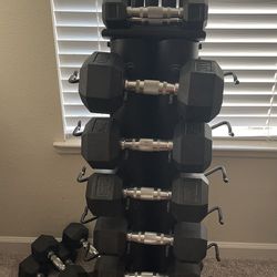 Vertical Tower complete with Rubber Hex Dumbell Set And 5 weight rubber coated workout bars.