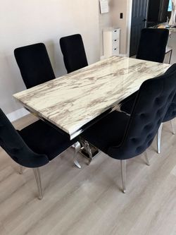 White marble 7 piece dining set table with black and silver soft velvet tufted chairs