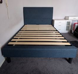 Blue upholstered full size bedframe