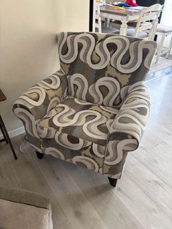 Upholstered Accent Chair with Bold Swirl Pattern