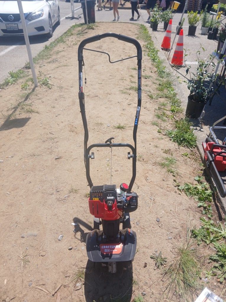 Craftsman C210 model.
Tiller. Used a couple of times works excellent.