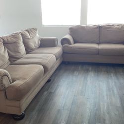 Sofa and loveseat also have coffee table to go with it