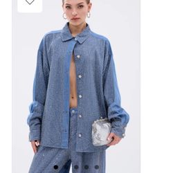 AKIRA oversized shirt is crafted from medium-wash denim for women