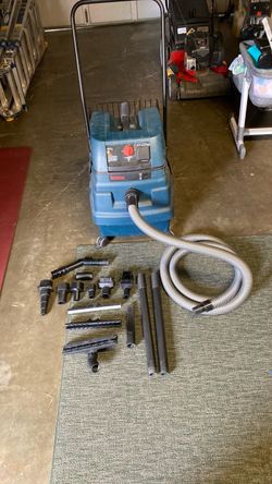 This is a Bosch Airsweep wet/dry shop vacuum featuring an integrated Pulse-Clean filter system and auxiliary power tool activation.