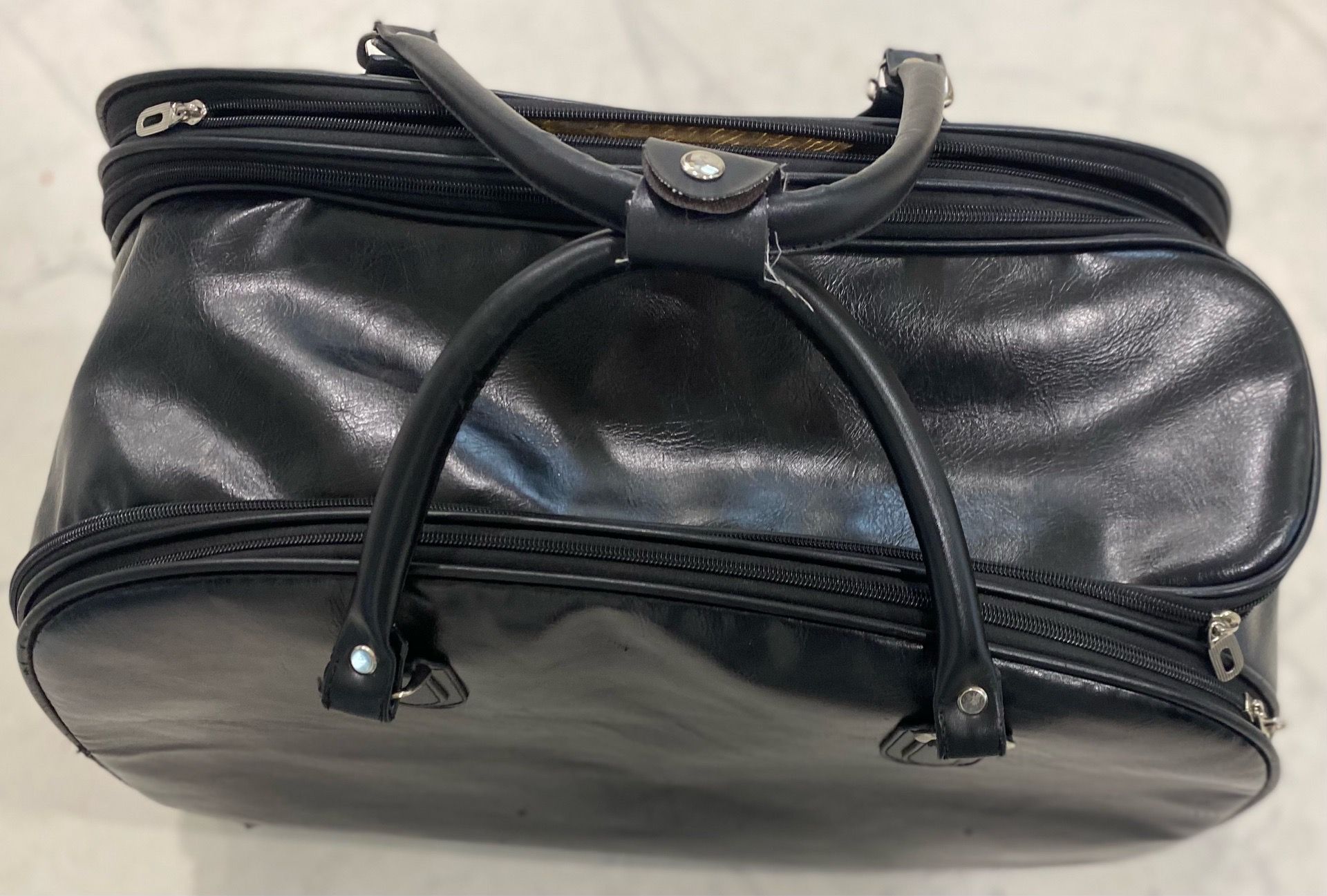 Large Black Leather Rolling Travel Duffel Bag with 3 Spacious Storage Areas & Lockable Zippers!