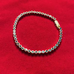 18k gold bracelet with emeralds