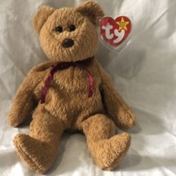 “Curly” beanie baby original with tags