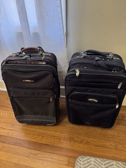 2 CARRY ON ROLLING SUITCASES 20 each