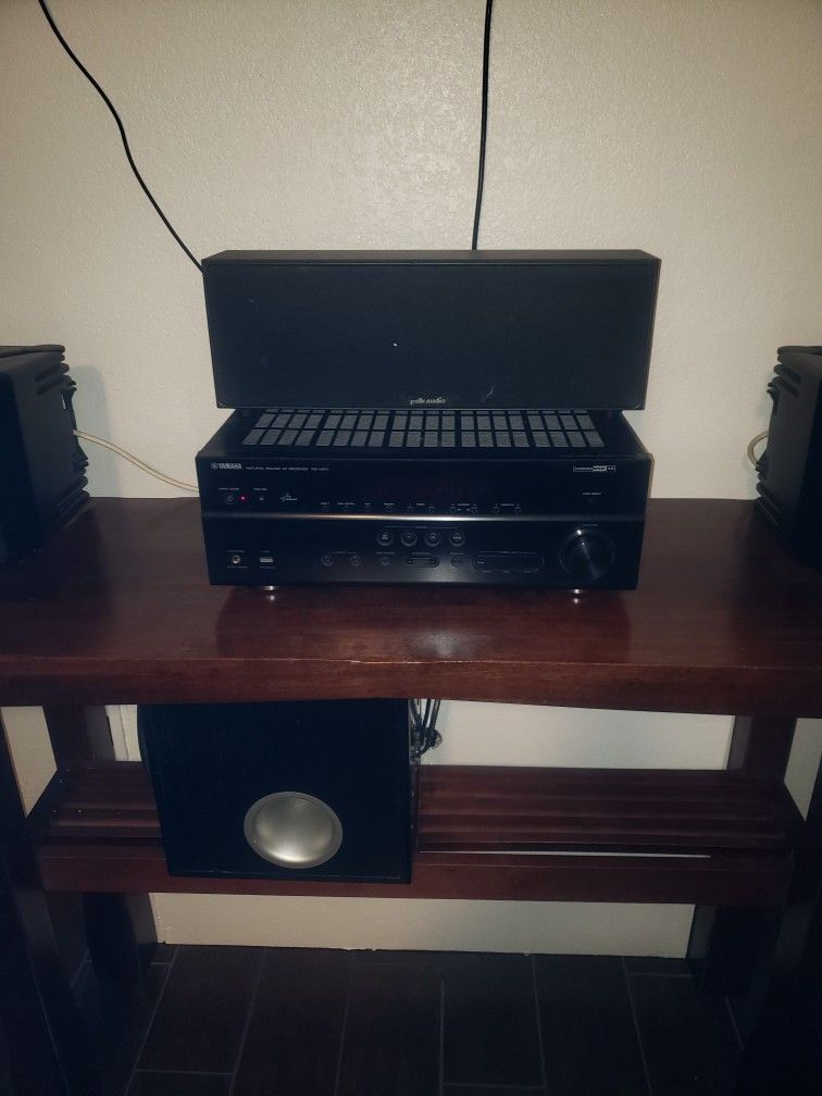 Receiver, Subwoofer, And A Couple Sets Of Speakers