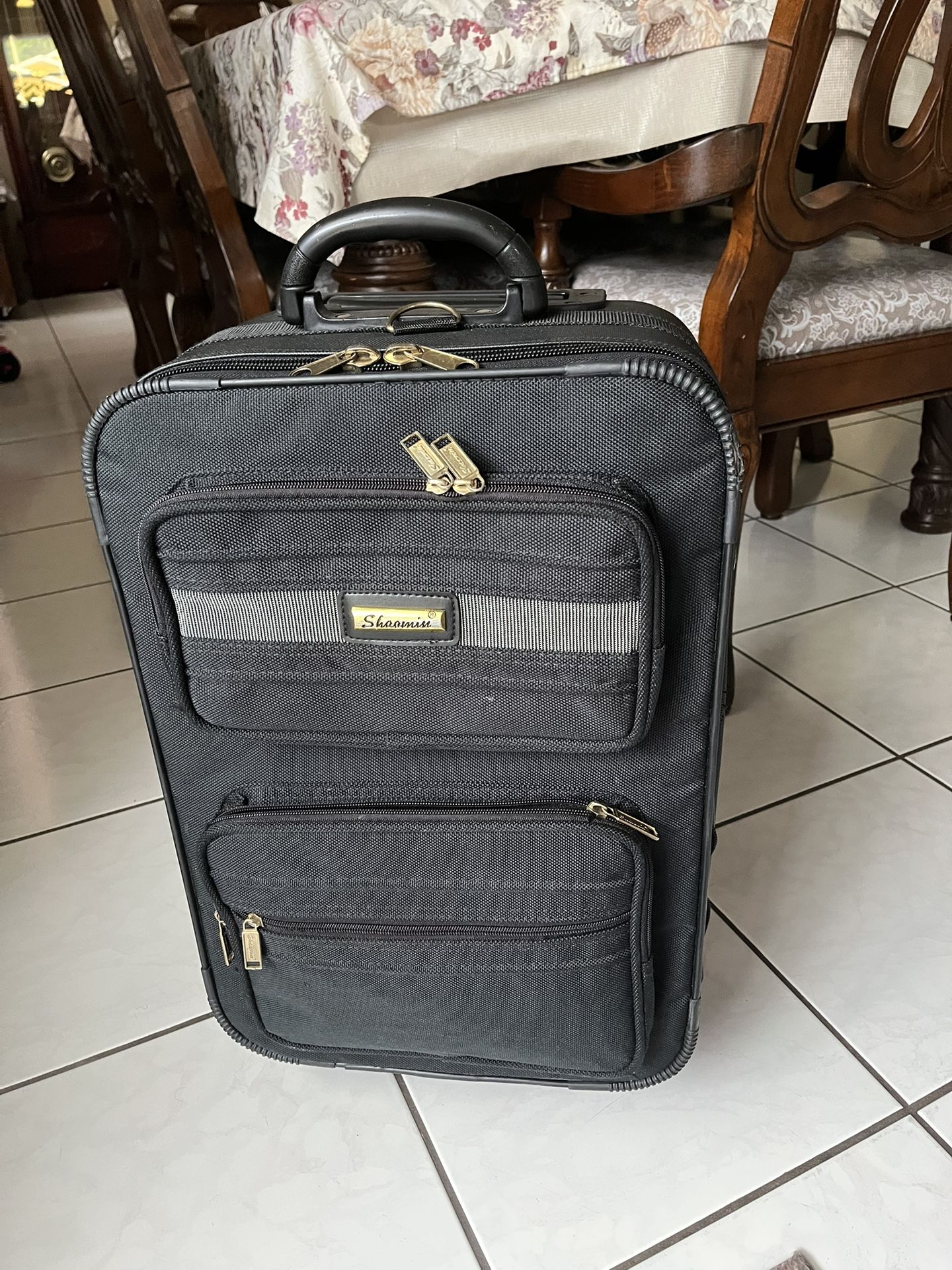 Used suitcase in good condition and clean. It measures 22 inches high, 14 inches wide, and 9 inches deep. It rolls very well.