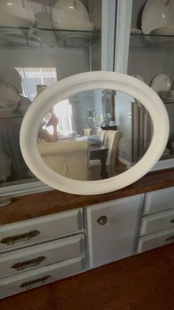 White oval mirror