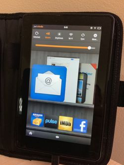 Amazon Kindle Fire tablet with a new DeWALT business carrying case, device adapted to case. Wi-Fi ready, runs on a modified version of Android OS.