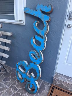 Rustic outdoor metal sign