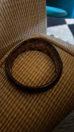 Vintage The image shows a wide, translucent resin or acrylic bangle bracelet with an embedded animal or leopard print pattern Dark Brown Bangle Bracel