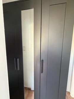 Tall and brow armoire wardrobe closet
