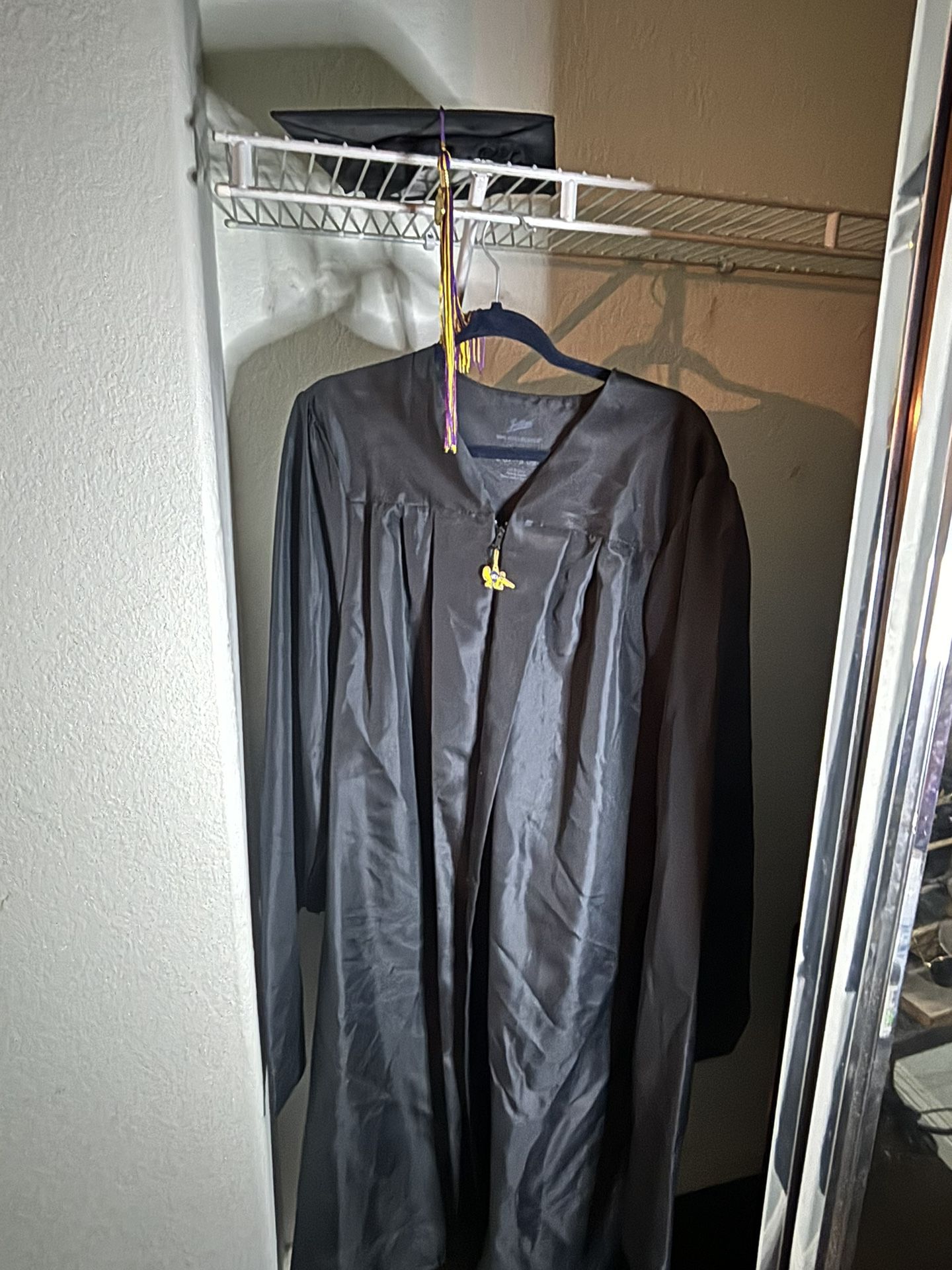 UCI masters graduation gown and hat