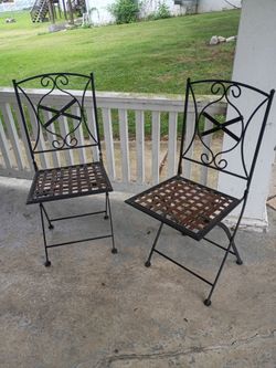 Vintage pair of wrought iron folding deck/patio chairs