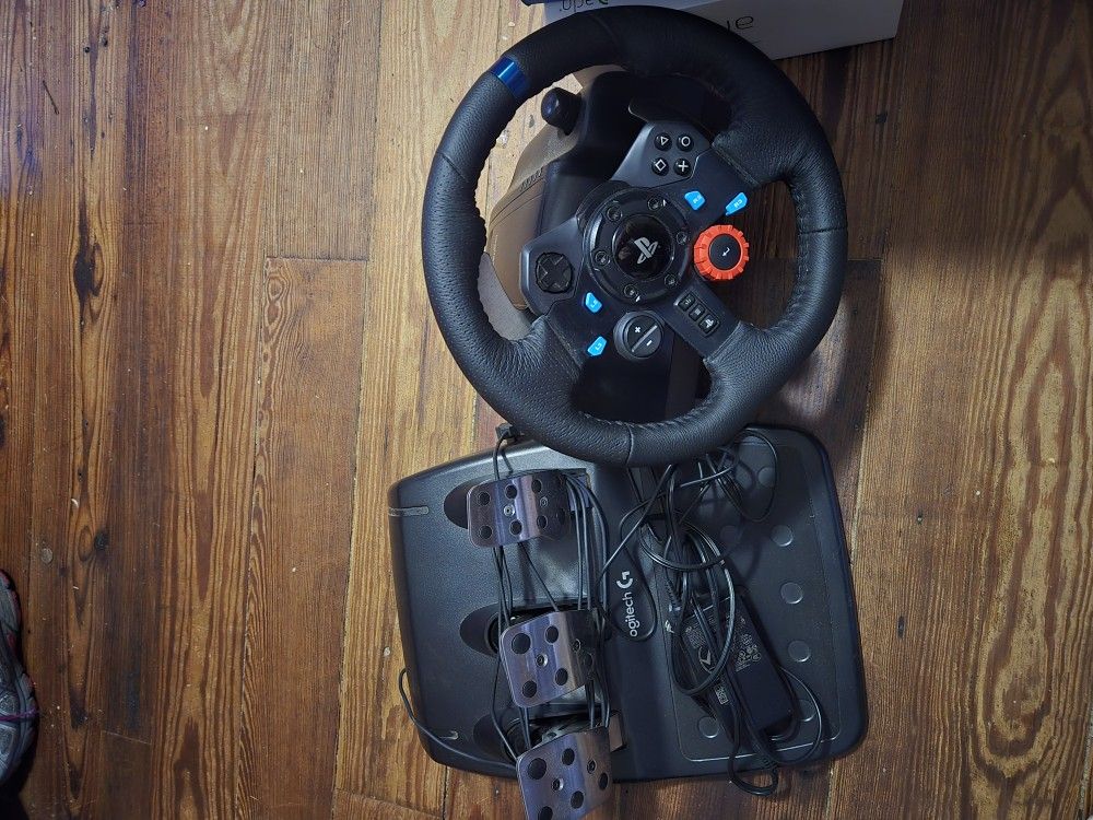 Logitech G29 Driving Force Racing Wheel and Floor Pedals, Real Force Feedback, Stainless Steel Paddle Shifters, Leather Steering Wheel Cover for PS5,