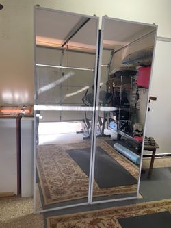 Rolling mirrored closet doors