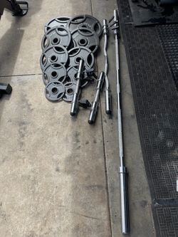 Olympic weights 240lbs total plus 7ft 45lbs bar and curl bar and dumbbells handles