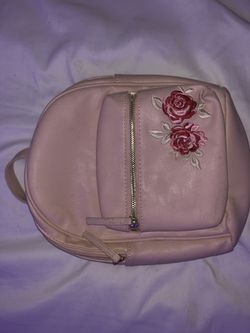 small pink backpack with roses