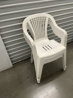 White stackable chairs used