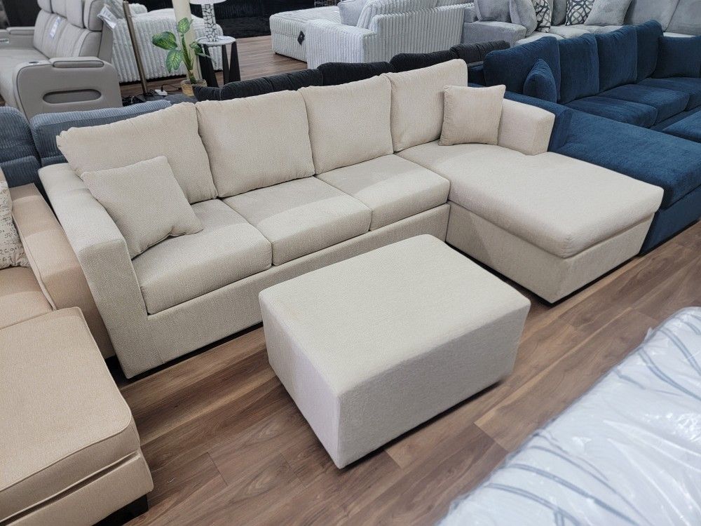 New 2pc Sectional And Ottoman In Sand