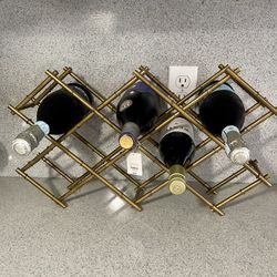 Brand New Brass Gold metal wine rack. Holds 8 bottles. 22x12x5