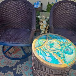 A set of vintage wicker swivel chairs plus cute table
