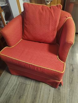 Small red orange sofa chair
