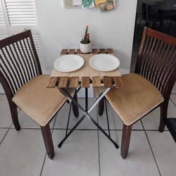 Two Wood With Suede Chairs And Small Table