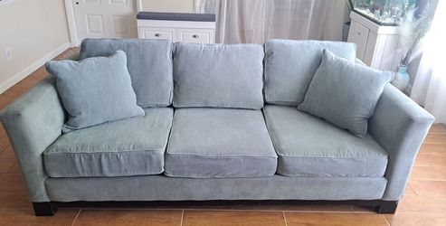 Light Green Sofa Bed with Throw Pillows