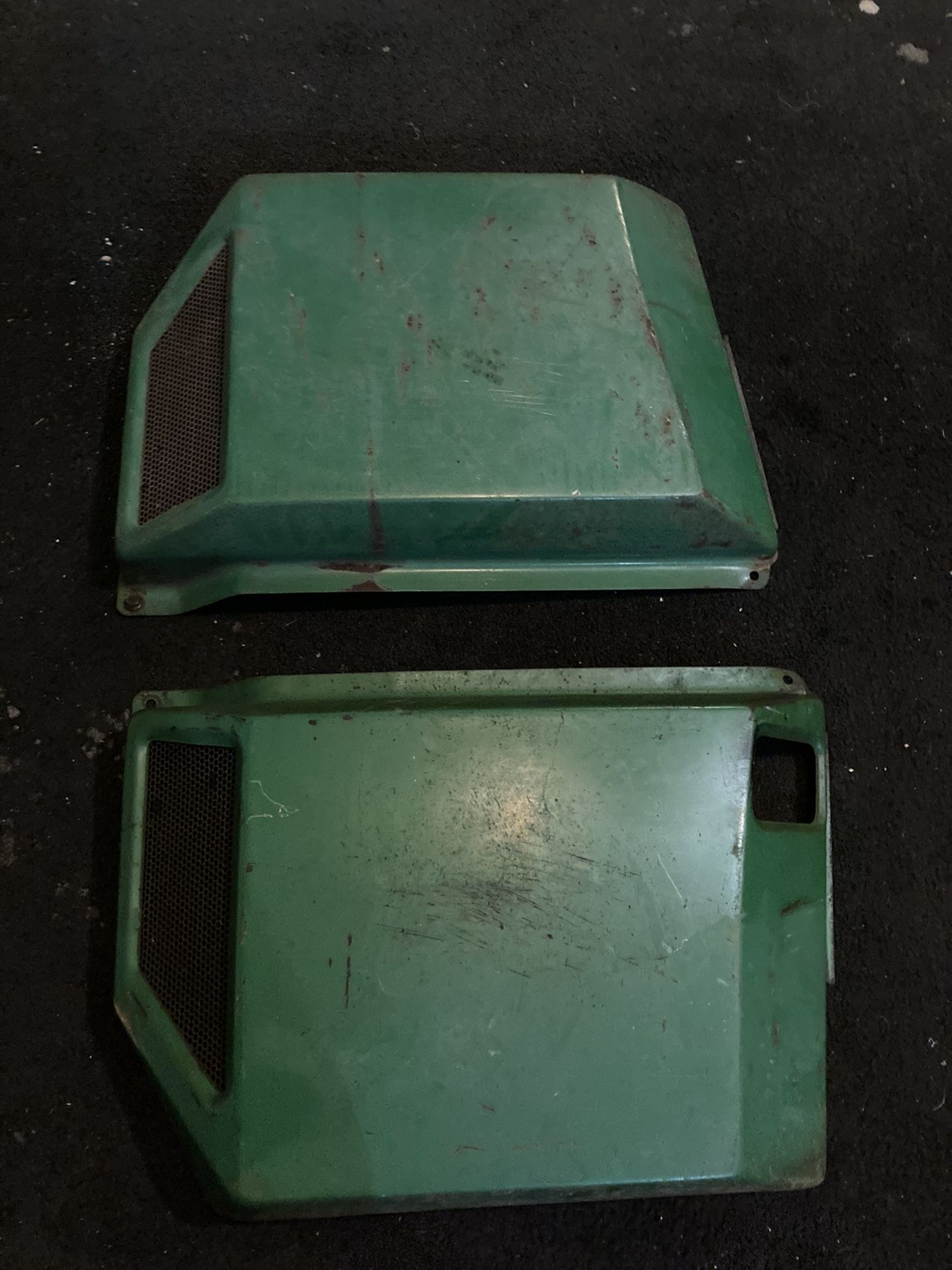 Side covers for a 318 John Deere tractor