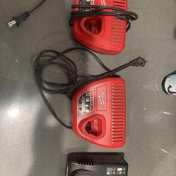 2 Milwaukee Chargers And A Snap On Charger