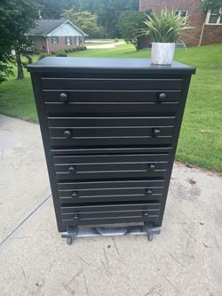 Tall black chester dresser