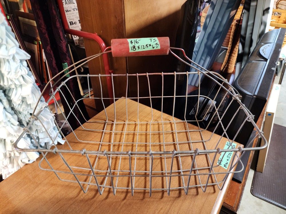 Antique wire basket with red wood handle
Farmstyle 
Antique 
18" w x 12.5"d x 6.25"h