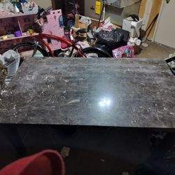 Marble Table A little over 64 inches long a little over 38 inches wide 30 inches high